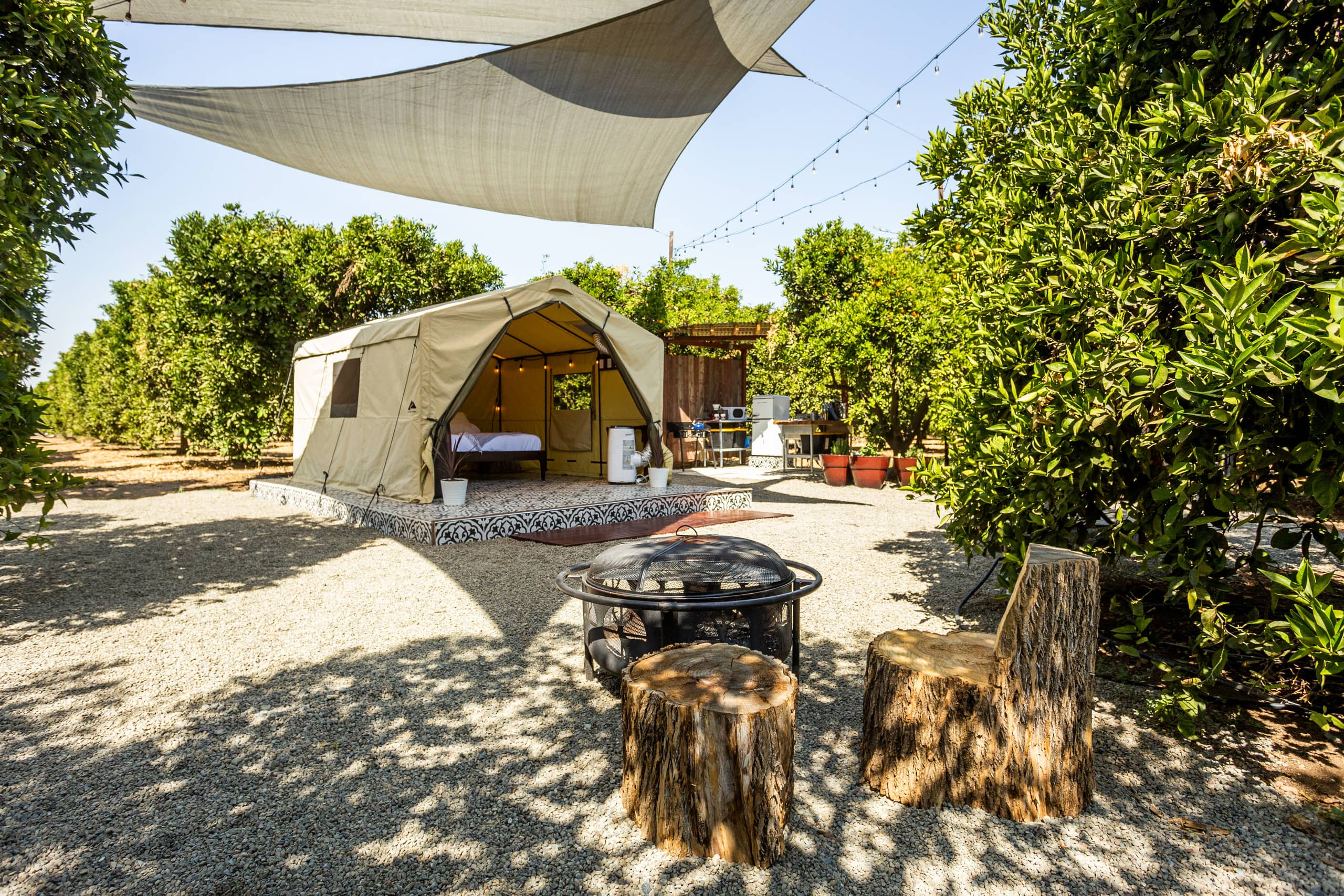 Wide view of the canvas tent and outdoor kitchen