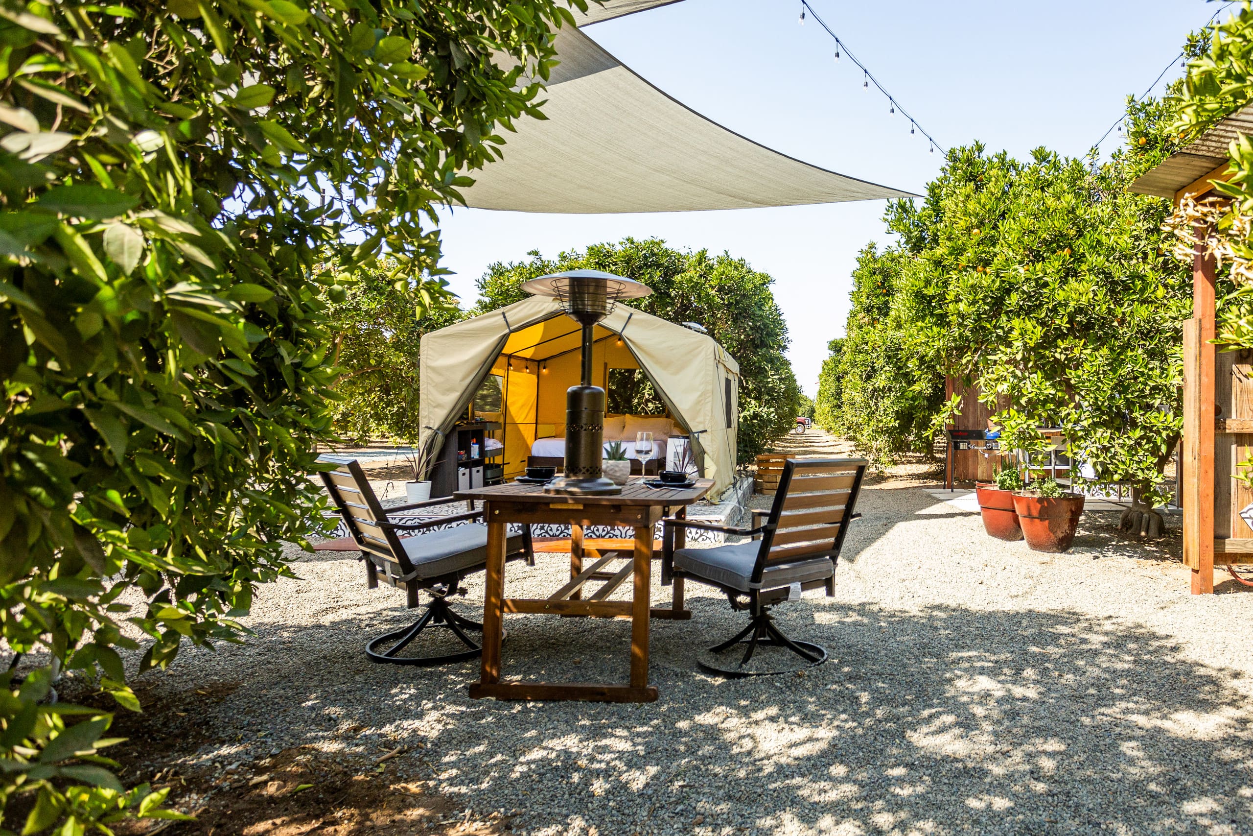 Fire pit with the canvas tent in the background